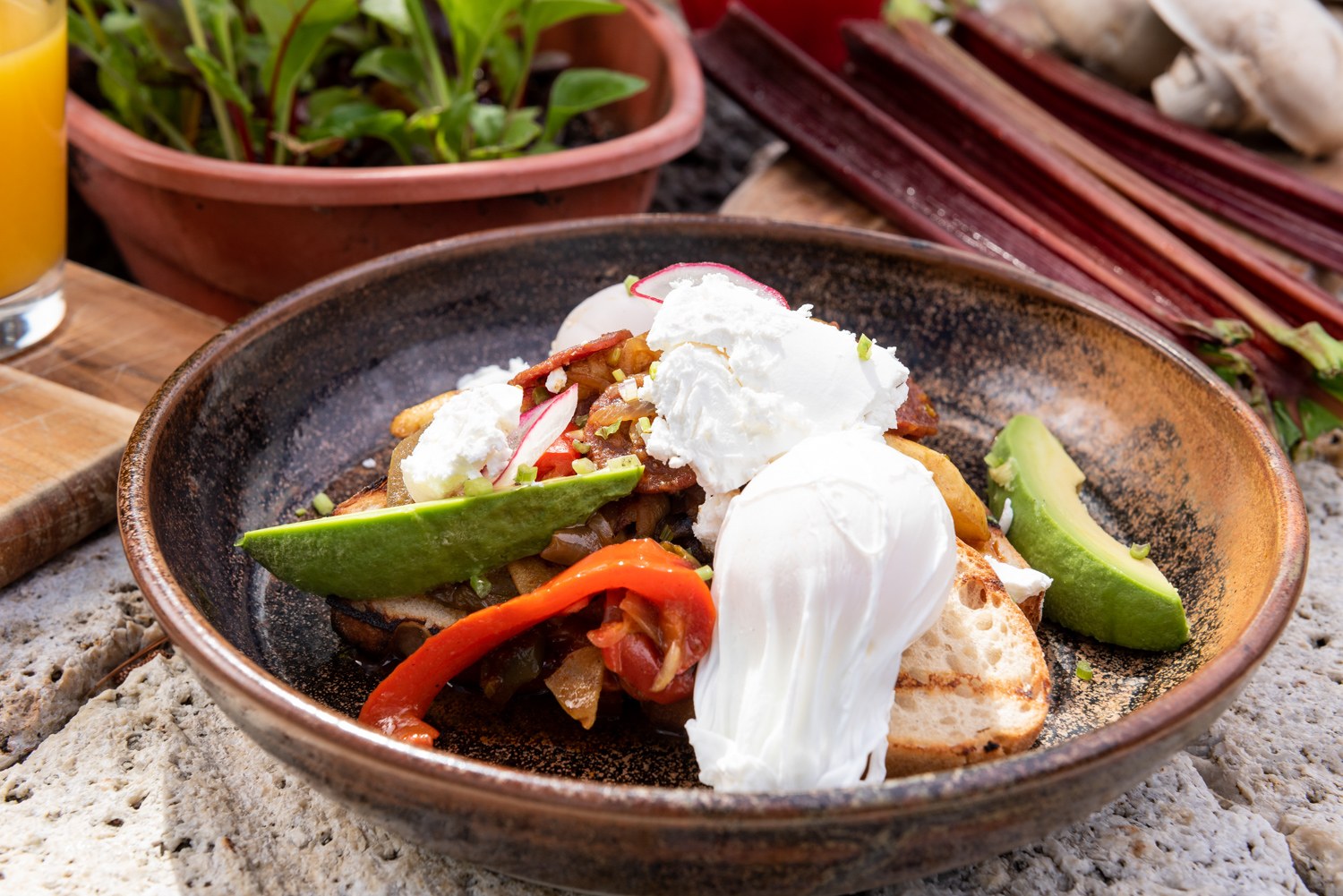 Plated breakfast with poached eggs and avocado