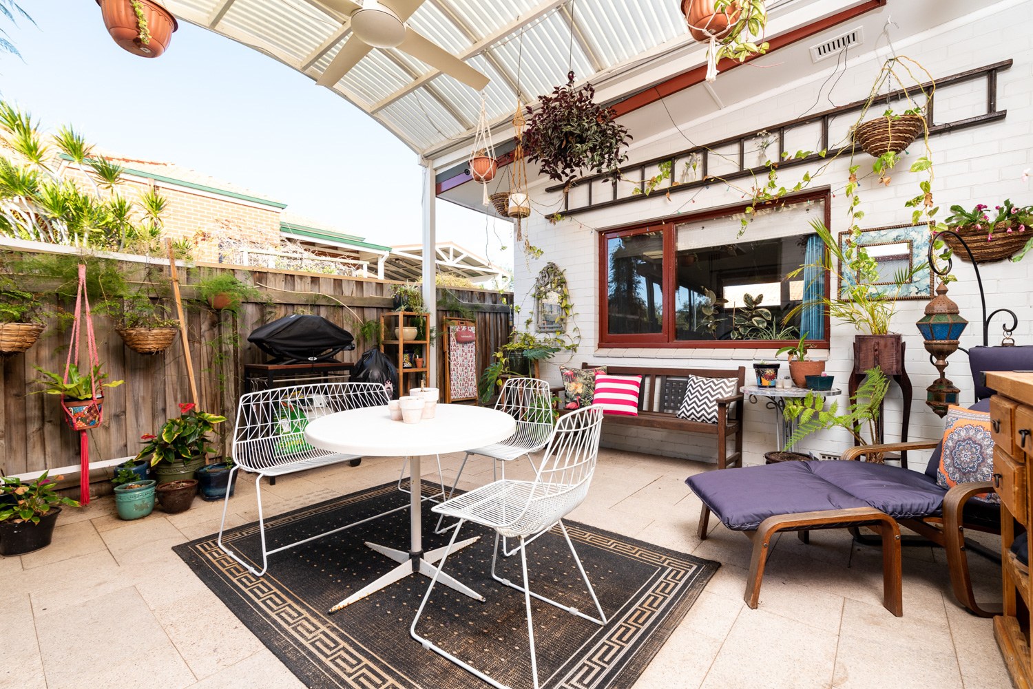 Covered outdoor dining area with plants in Bicton