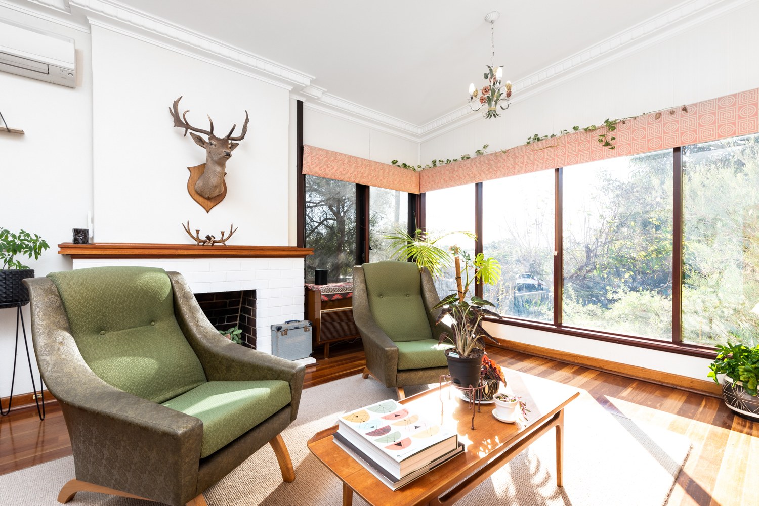 Character living room with timber floors and large windows in Bicton