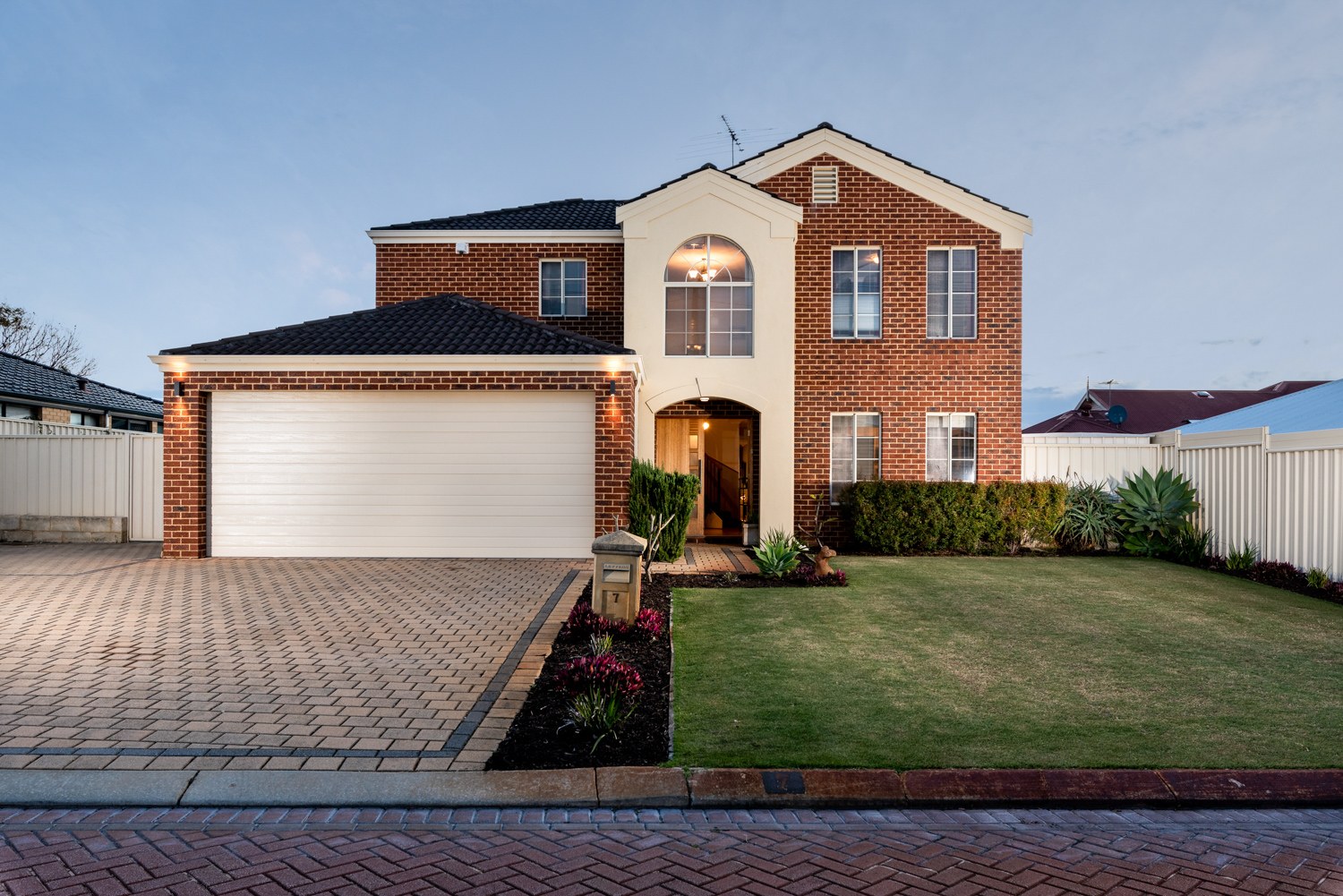 Two-storey brick home at twilight in Canning Vale