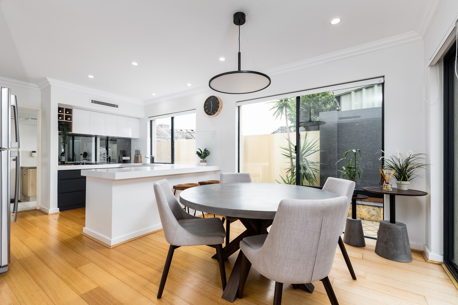 Bright dining area with timber floors in Doubleview