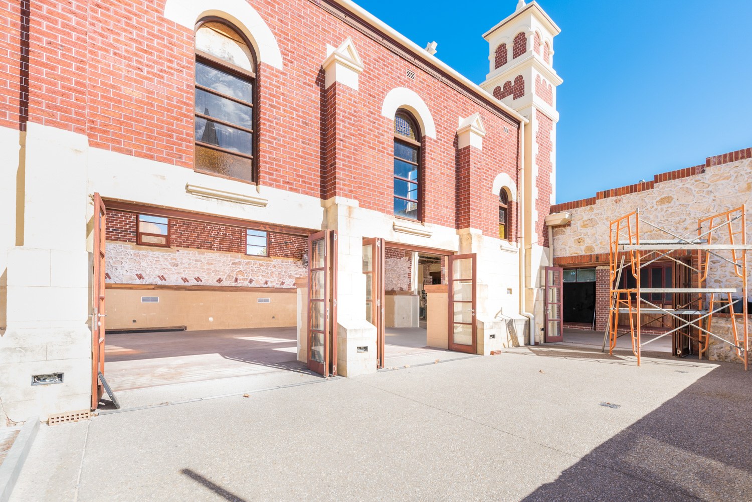 Red-brick character building with arched windows in Fremantle