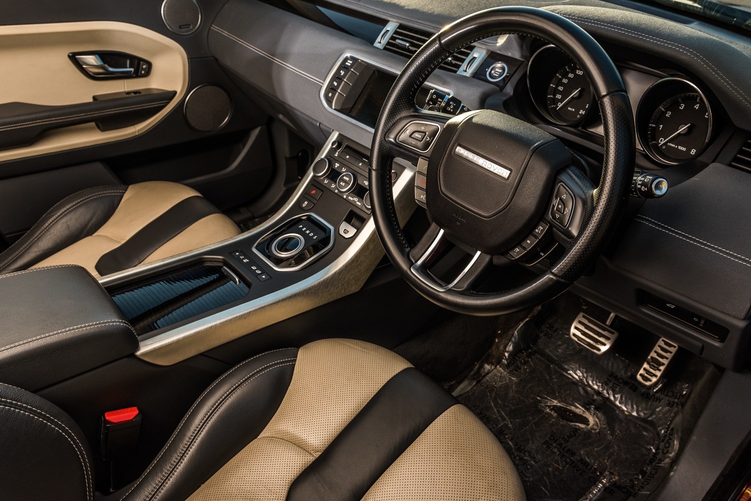 Range Rover cabin showing seats, dashboard and steering wheel